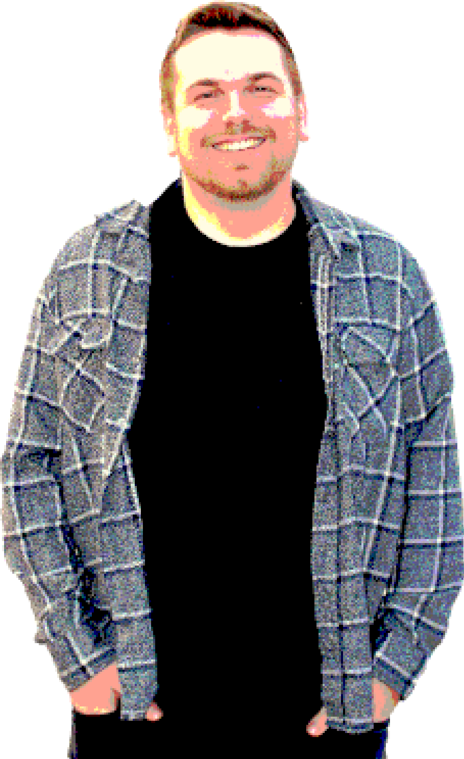 Portrait of the site owner smiling, in a plaid flannel over a black t-shirt